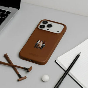 Brown leather iPhone 17 Pro Max case with Santa Barbara design on desk.