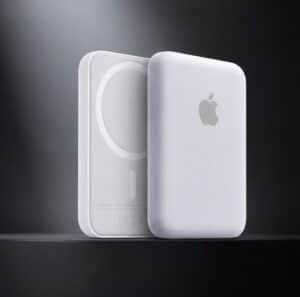 White MagSafe-compatible power bank with Apple logo on a dark background.