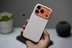 White silicone phone case with orange camera protection for iPhone 17 Pro Max.